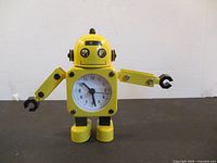 Front view showing dial, arms, and eyes