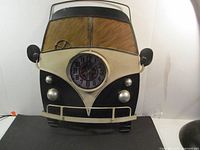 Front view of metal camper van clock showing full design