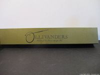 Olive green Ollivanders box lid with logo