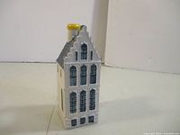 Front view of ceramic KLM Delft Blue miniature house #52