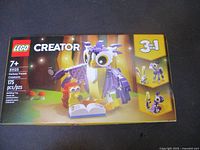 Front of sealed LEGO Creator 31125 box showing owl model, piece count and age rating