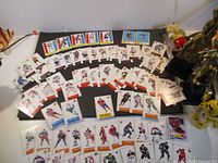 Wide shot of entire spread of hockey cards displayed on black background