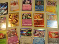 Overall view of 15 holographic Pokémon cards laid out