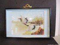 Front view of framed shadow box artwork showing cranes