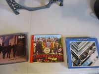 All three Beatles CD albums in jewel cases