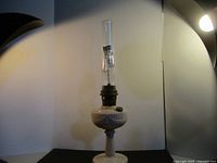 Full view of Aladdin ivory glass oil lamp with chimney