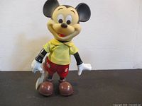 Front view of Mickey Mouse figure standing upright