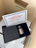 Open set showing die and certificate