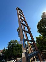 Full height view of 12-ft orchard ladder leaning upright