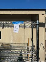 Top portion of chrome rack showing wire shelf and corner post