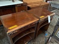 Pair of nightstands side by side showing tops and fronts