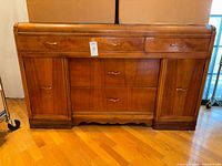 Front view showing drawers, cabinet doors, overall design