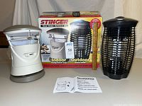 Indoor trap, outdoor zapper, box, manual and ruler for scale