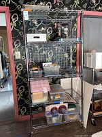 Full view of chrome 5-shelf rack with casters and adjustable shelves