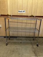 Full view of chrome wire rack showing three shelves and casters