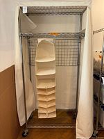 Chrome rack without cover showing shelves and hanging organizer