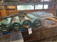 four green rolls Sun Screen Fabric on shelf