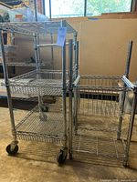 Both chrome racks side by side showing size difference and shelving