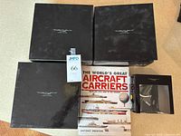 Four Century Wings boxes, book and smaller box displayed