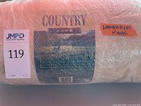 Rug label showing Country Home branding and wrapped rug