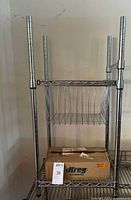 Overall view of chrome rack with wire basket and box
