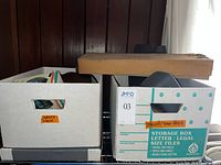 Two boxes labelled camera equipment on shelf