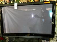Front view of Vizio 42" plasma TV on stand