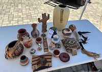 All 22 Southwestern pottery and décor pieces on table