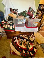 Wide view showing pillows, quilt, tree skirt, bins