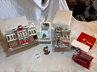 Overall lot showing buildings, billboard, Neon Sign box, figurine