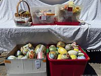 Full lot with eggs in bins, boxes and basket
