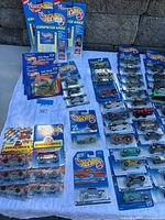Overall view of sealed Hot Wheels singles, Computer Cars, Chuck E. Cheese’s promos and trading card packs