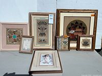 All seven framed artworks grouped together