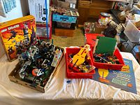 Overall lot showing 6097 box, red trays with loose Lego, Ronald McDonald figure, castle parts