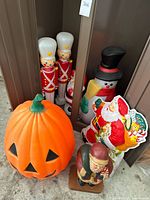 Group shot of pumpkin, soldiers, snowman, Santa items