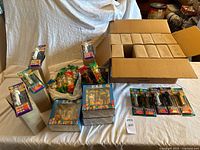 Overview of lot: boxed sets, ceramic jar with bagged dispensers, blister packs, master carton