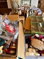Assortment of Christmas decor in open boxes on table