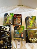All six sealed Star Wars figure packages laid out