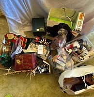 Overview of lot showing boxes, tins and assorted decor on floor