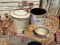 Group shot showing all crocks, bowl, jar, and plaque