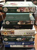 Stacked view of all eight puzzle boxes