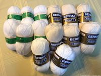 Group shot of all 14 yarn skeins showing brands and colors