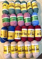Front view of 22 skeins stacked by colour