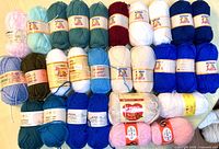 All 28 yarn balls laid out in four rows for full lot overview