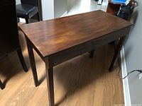 Console table angled view showing legs and top