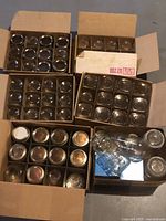 Six boxes filled with divided compartments of canning jars