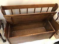 Bench open showing storage compartment interior