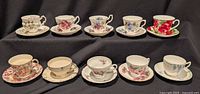 All ten teacup and saucer sets displayed