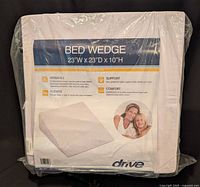 Front view of packaged Drive Medical bed wedge showing product label