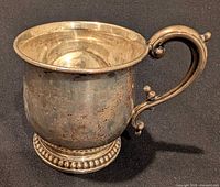 Full view of Birks sterling silver baby cup with handle visible